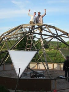 Two owners posing during their Growing Dome Greenhouse build in Sweden