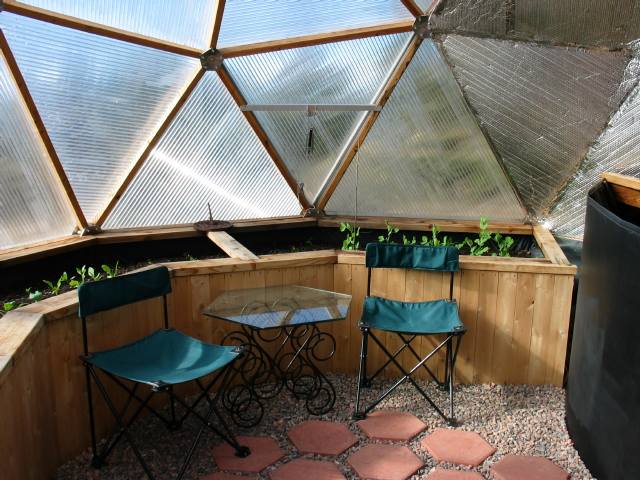 vertical slat raised beds in geodesic dome greenhouse