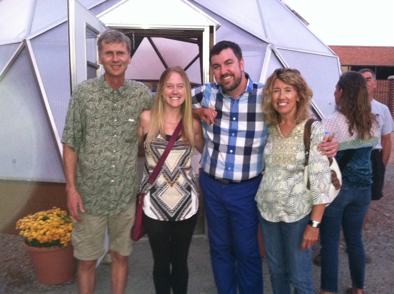 Community Project Littleton Academy - Growing Spaces Greenhouses People pictured in front of a growing dome, Community Garden Grant for Growing Dome in Littleton Colorado