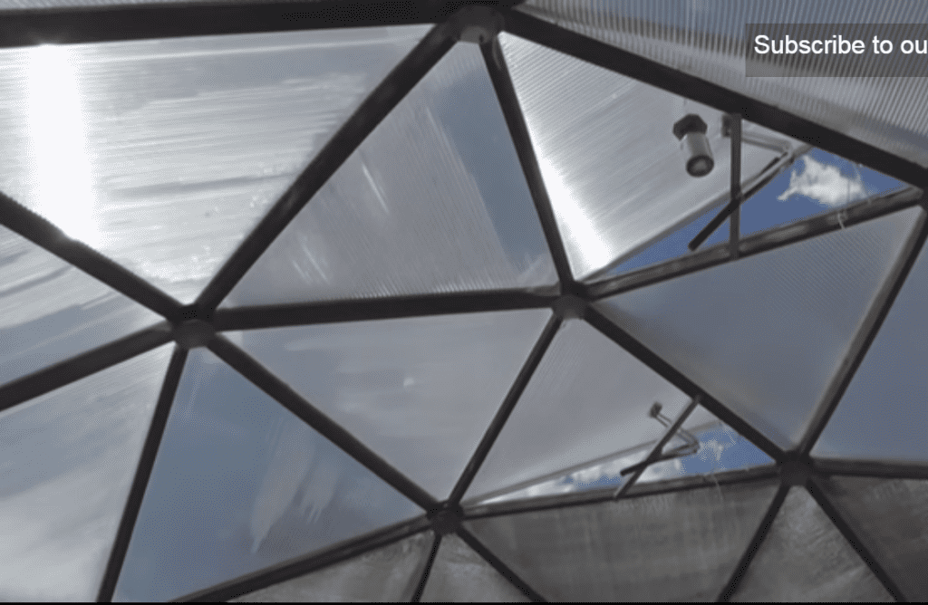 Upper vents helping to cool a growing dome greenhouse