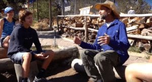 two people talking on an off grid farm