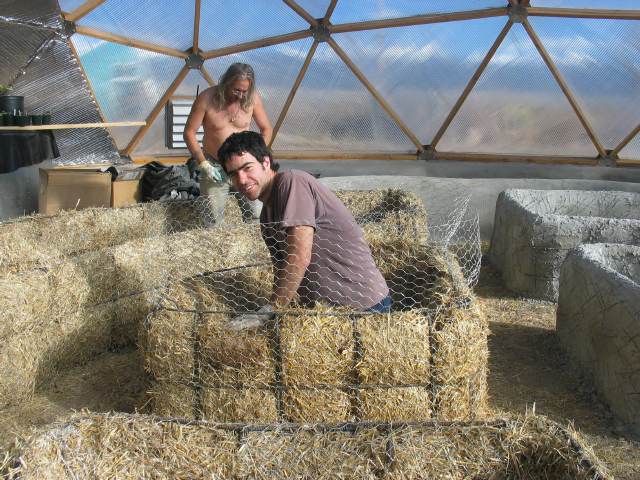 stucco planting bed construction in geodesic dome greenhouse
