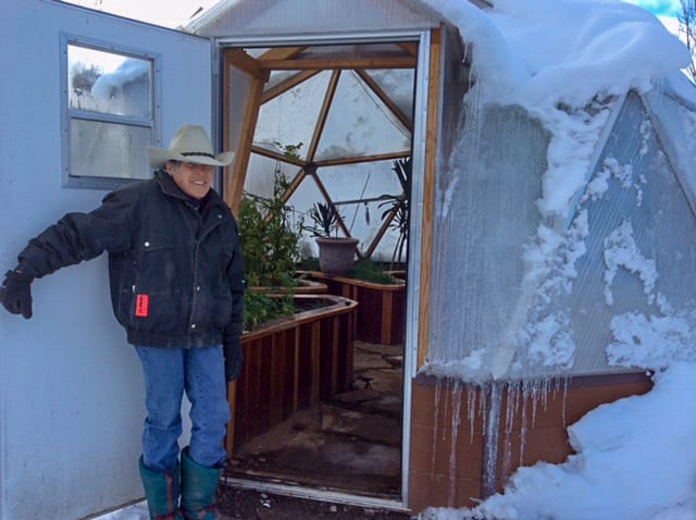 Josie showing our 18 foot Growing Dome Greenhouse