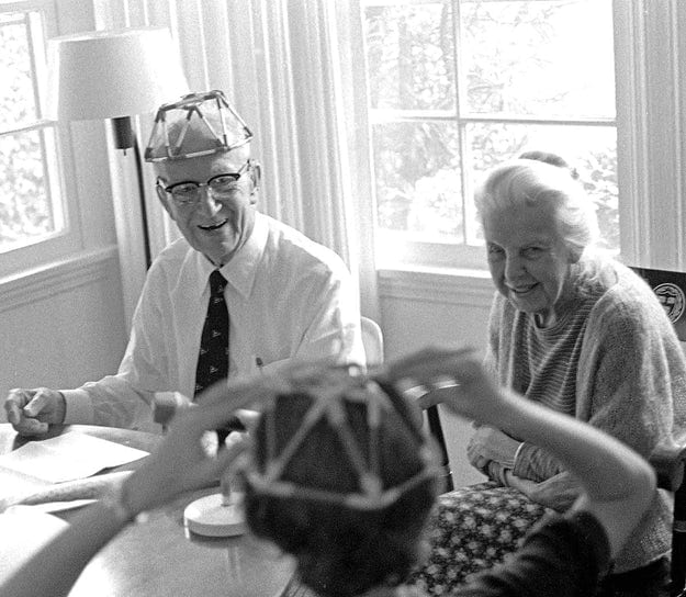 Anne and Bucky wearing a geodesic dome birthday cap