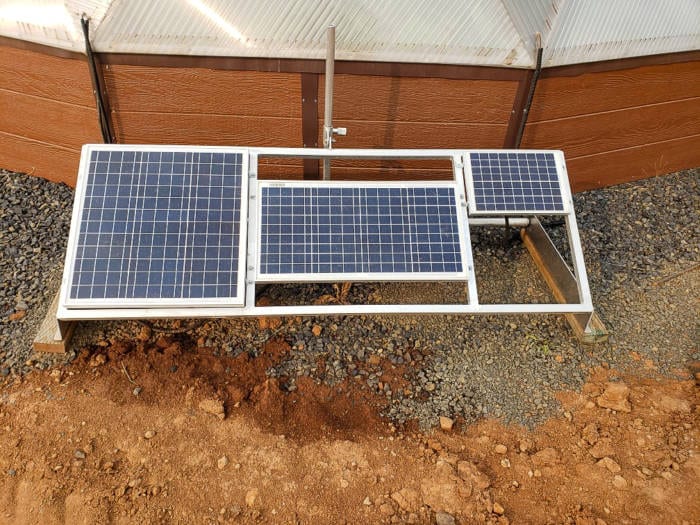 Solar panels to power the backyard greenhouse