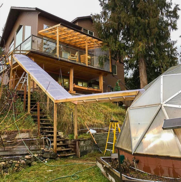 Covered walkway to geodesic greenhouse