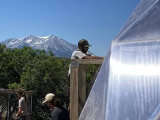 Install in Carbondale - Growing Spaces Greenhouses Growing Spaces Employee Installing a Growing Dome in Carbondale Colorado