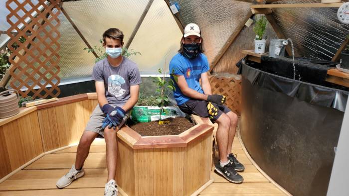 Grandkids inside automated greenhouse