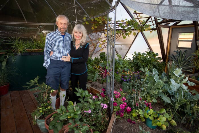 Udgar and Puja Parsons in their 22' Growing Dome Greenhouse