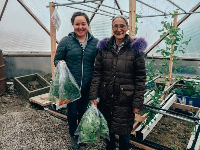 164773900_1424578894554557_5316367696766814589_n-1 - Growing Spaces Greenhouses Community members with fresh greenhouse produce