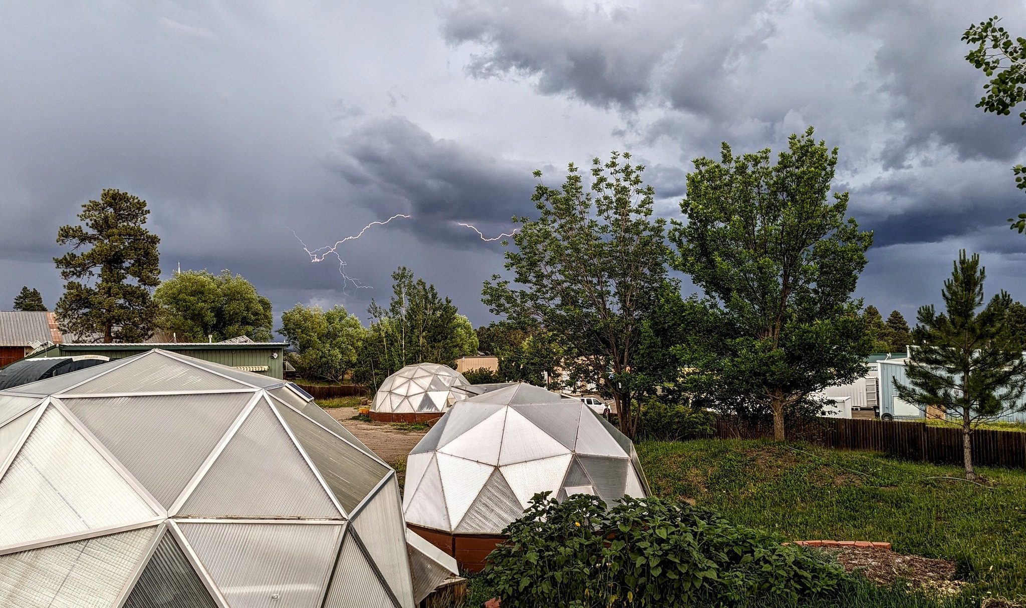 thunderstorm over greenhouses