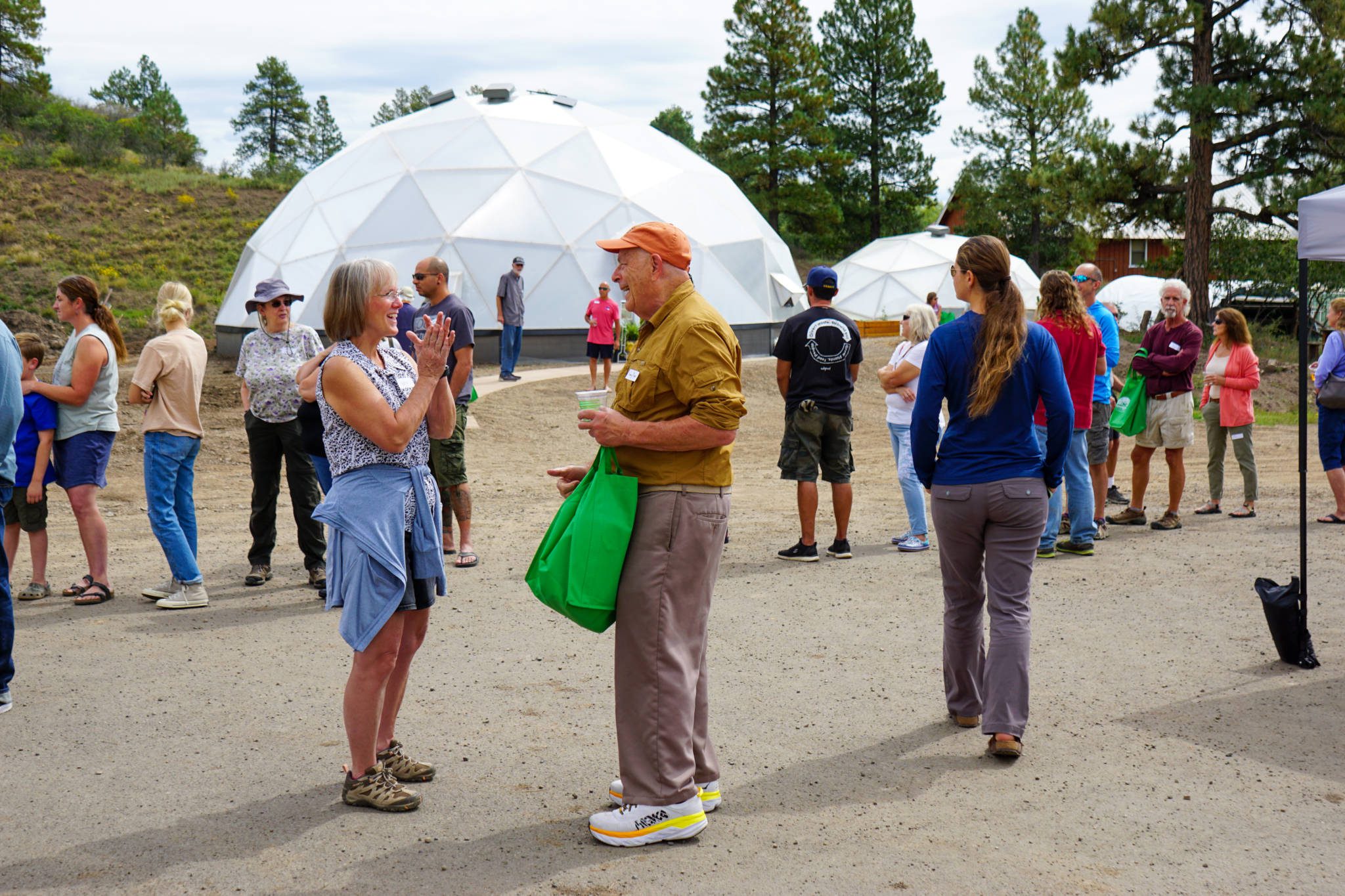 Customer Appreciation - Growing Spaces Greenhouses Group of Growing Dome owners at the 2022 customer appreciation event outside of a 42' Growing Dome
