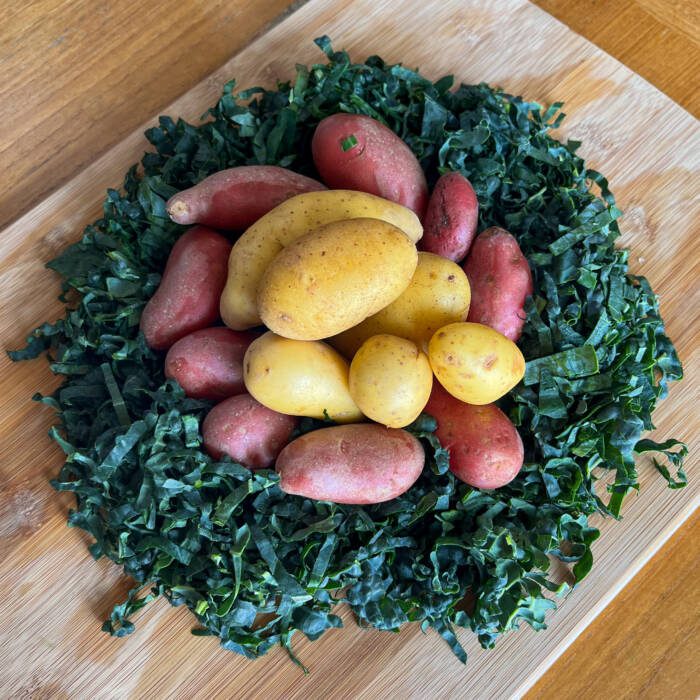 Fingerling Potatoes nestled in a bed of finely chopped kale