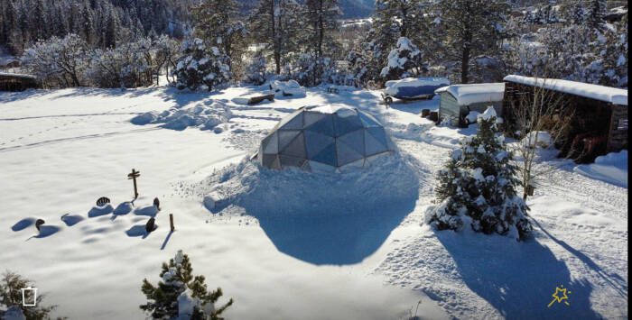 Backyard greenhouse in the winter