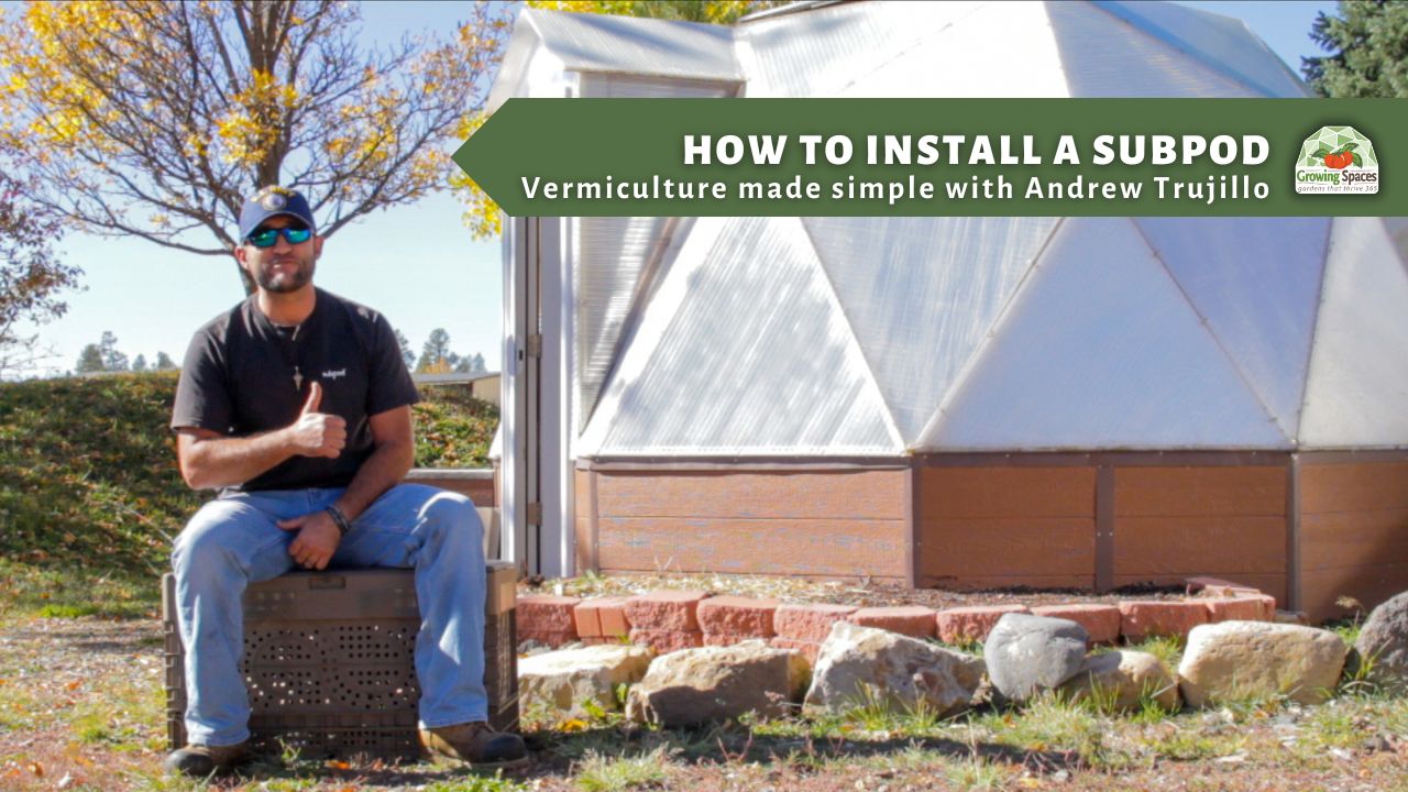 Andrew Trujillo sitting outside a Growing Dome giving a thumbs up