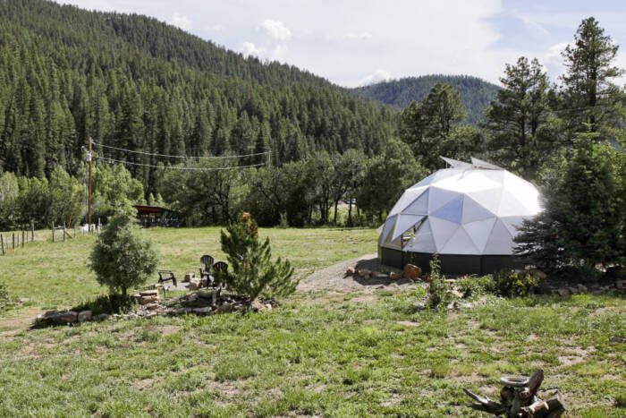 Backyard greenhouse in the spring