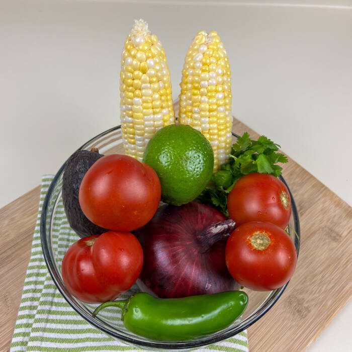 Ingredients in a bowl for The Ultimate Roasted Green Chili Corn Cakes with Fresh Corn Salsa