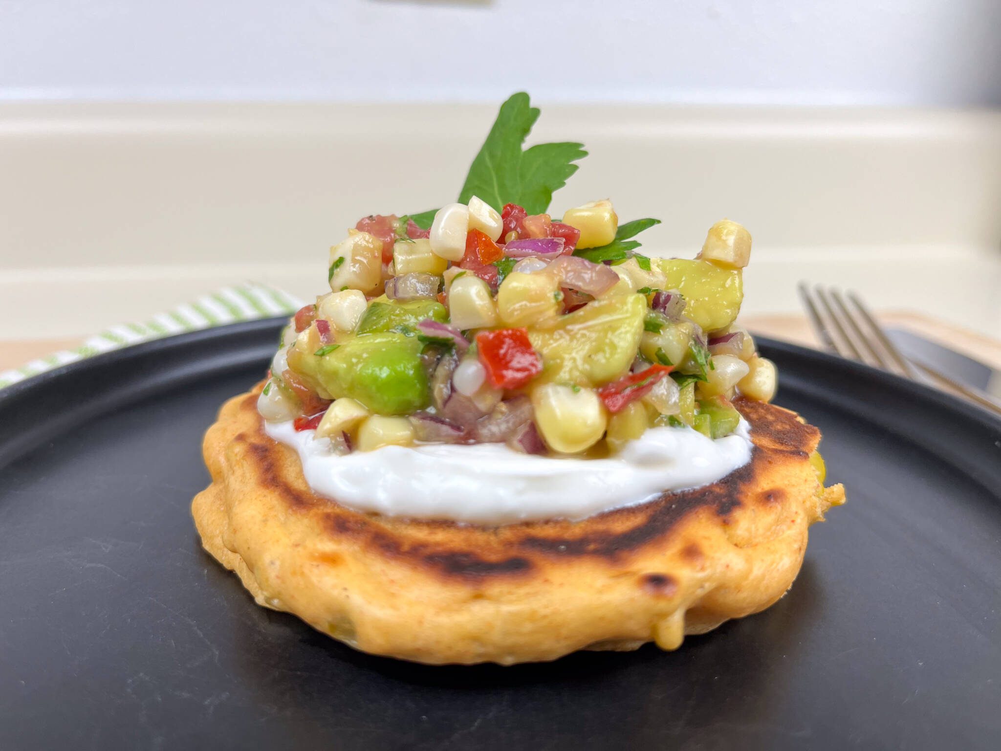 fire roasted hatch green chili corn cake topped with fresh corn salsa