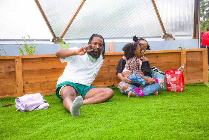 people sitting on grass in a dome