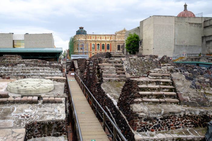 Pre-hispanic ruins of the aztec city of Tenochtitlan in Mexico City - Growing Spaces Greenhouses Ruins of the Aztec city of Tenochtitlan surrounded by modern buildings in Mexico City