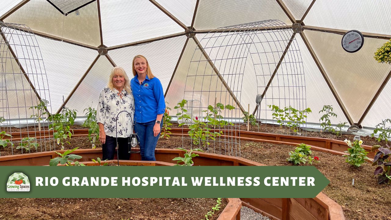 Rio_Grande_Hospital_Wellness_Center - Growing Spaces Greenhouses two women stand together inside a newly planted Growing Dome smiling and looking at the camera