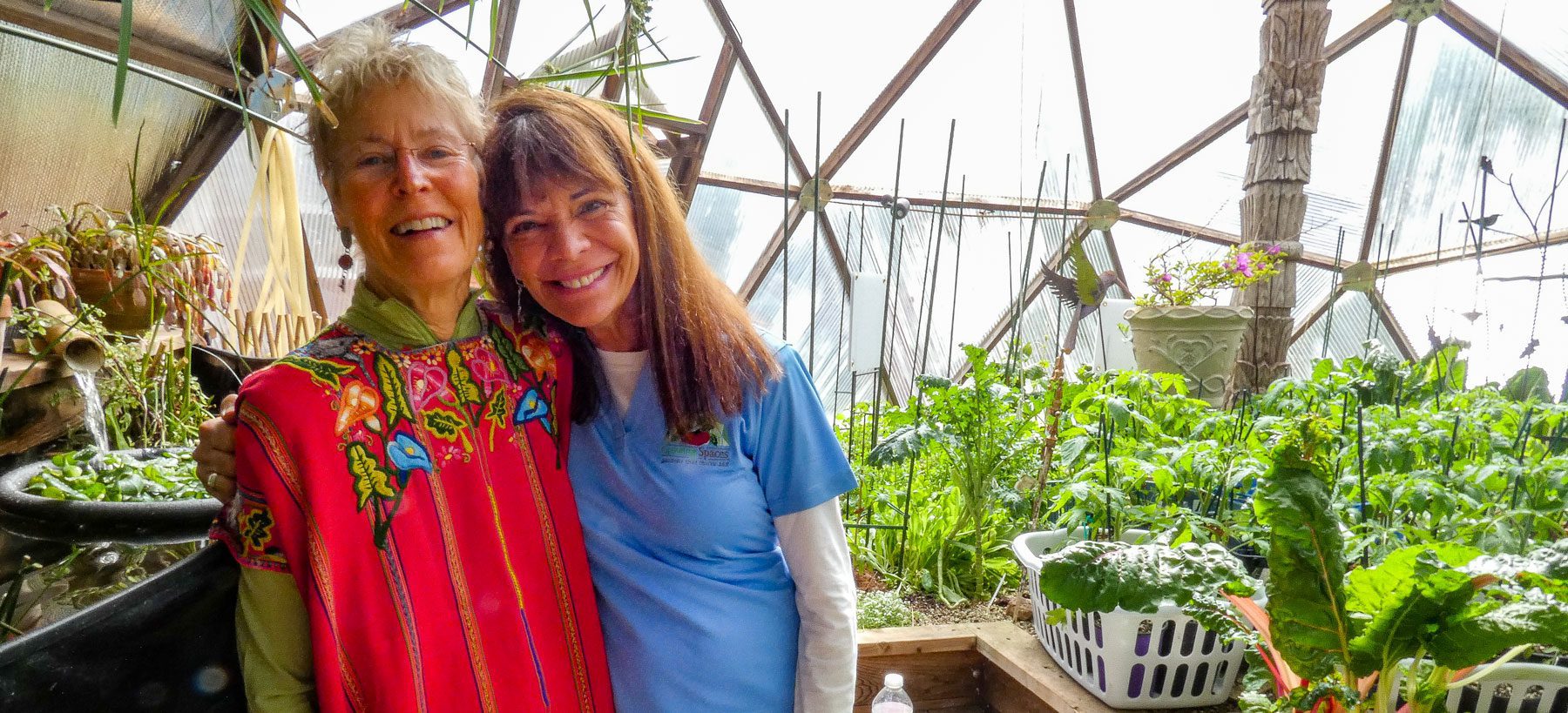 Claudia and Val inside Growing Dome Greenhouse