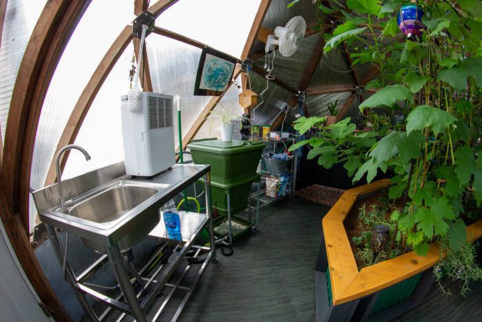 working sink, dehumidifier, compost system, and shelving in a 22' Growing Dome