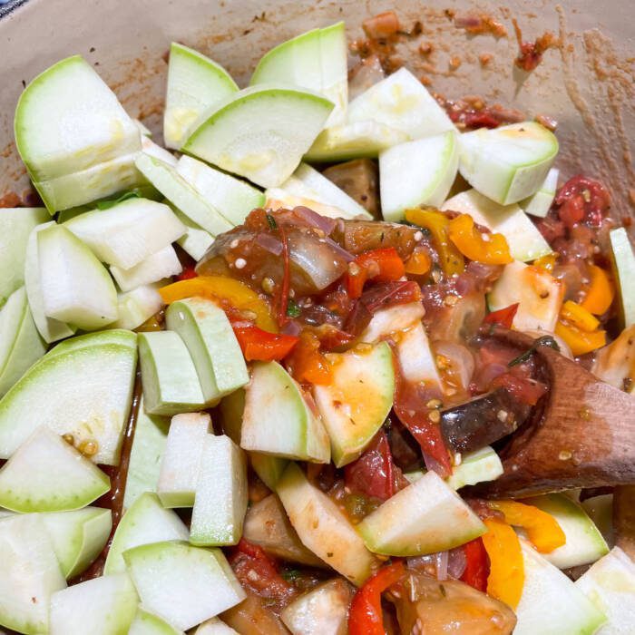 fresh white zucchini added to the stew pot