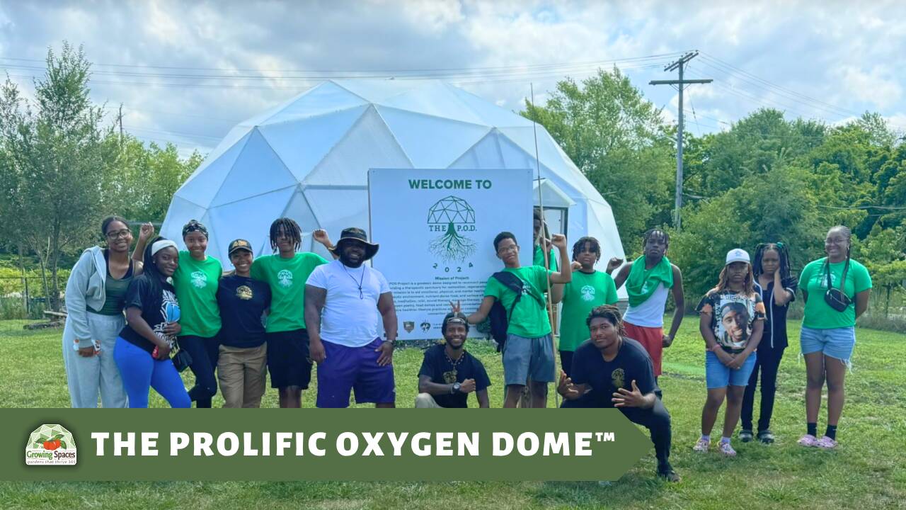 The POD YouTube Header Images - Growing Spaces Greenhouses A Group of Student and educators posing for a photo in front of a Growing Dome greenhouse.